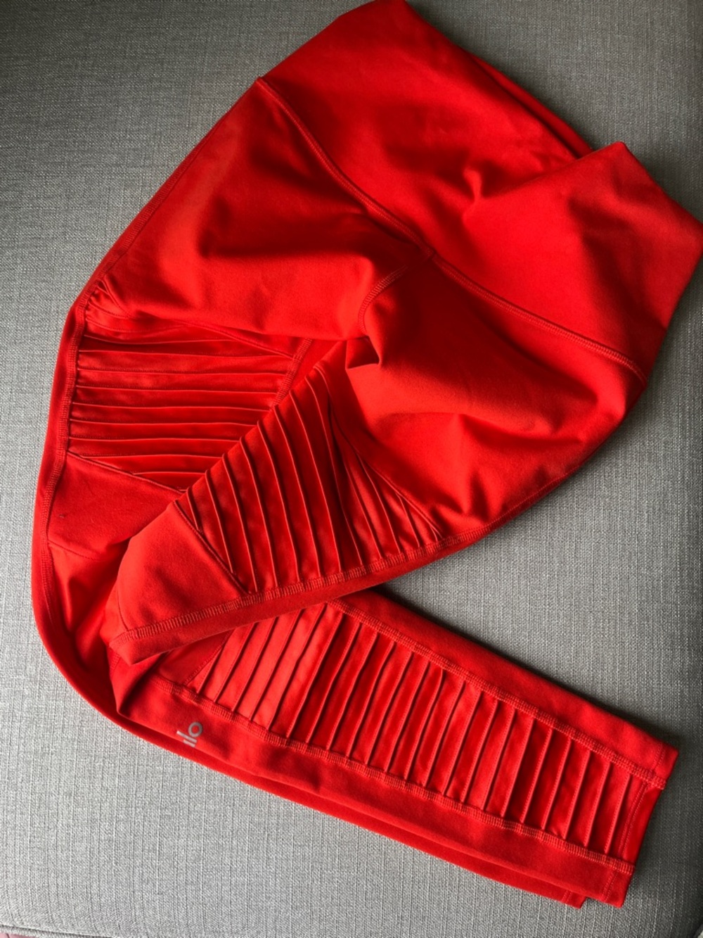 alo brand moto leggings in red-orange